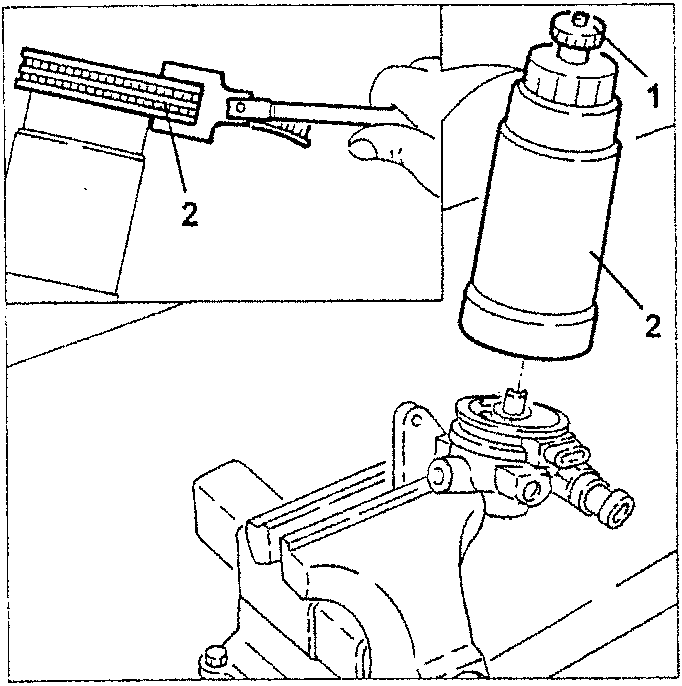 Fuel filter being removed with a tool