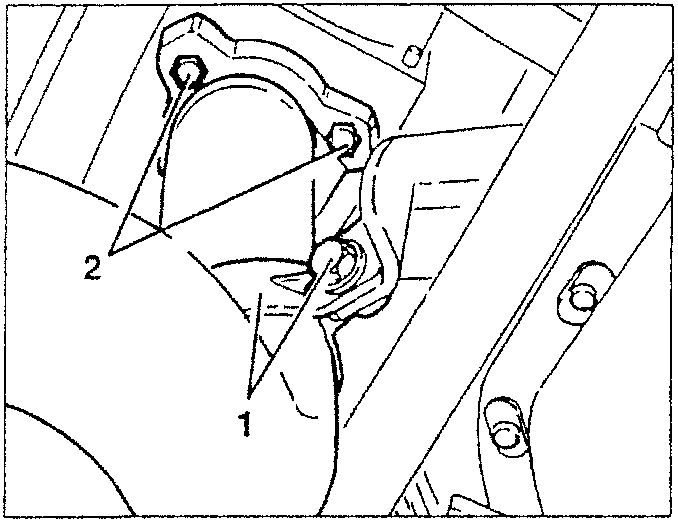 Close-up of turbocharger connection showing screws securing front section of exhaust pipe.