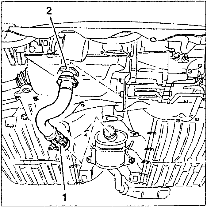 Under-hood view showing exhaust pipe connection to turbocharger and engine components.