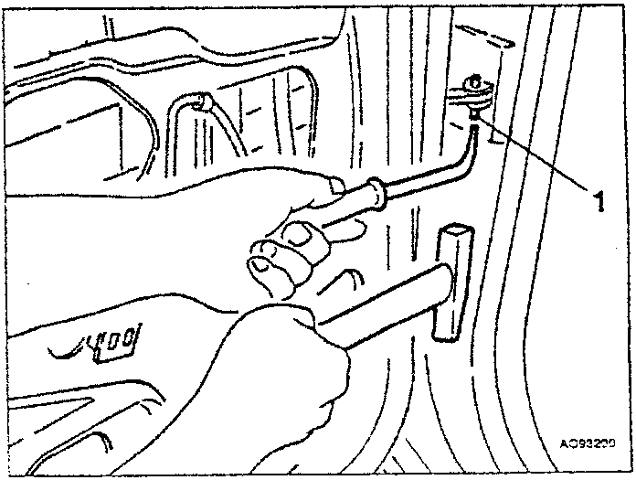 Door check rod being pulled out with tool