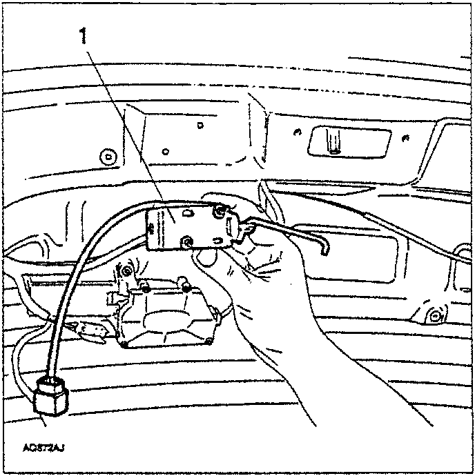 Hands removing the tailgate opening control actuator from inside the tailgate.