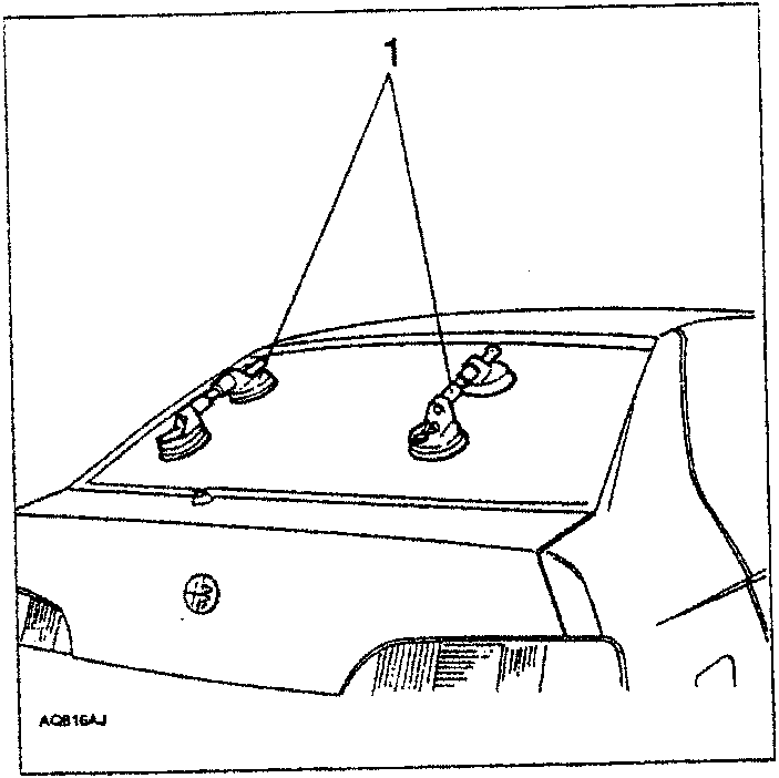 Illustration showing special suction grips attached to the rear screen of a car.