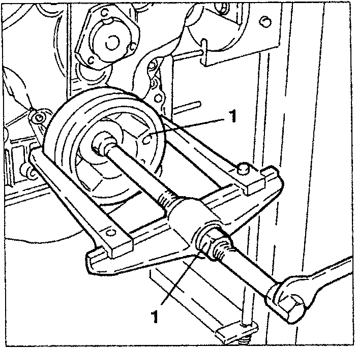Illustration showing removal of auxiliary components drive pulley with a puller tool