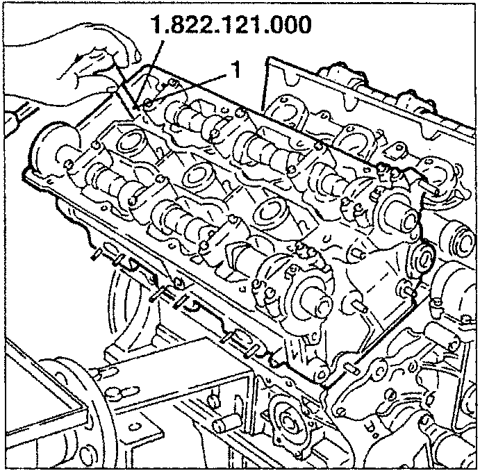 Cylinder heads with wrench 1.822.121.000 applied to part 1
