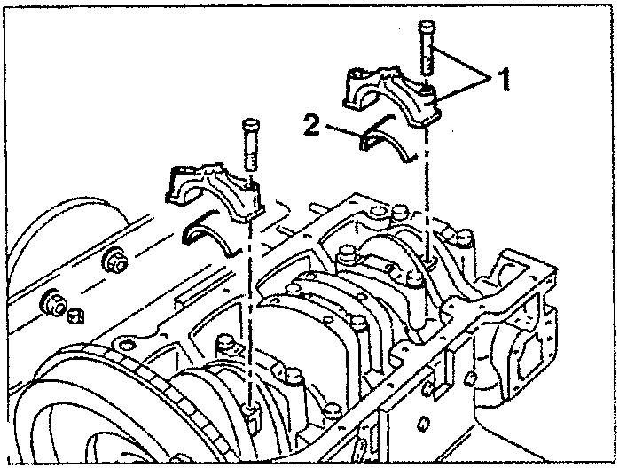 Engine block with piston-rod assemblies removed, showing rod caps and bearing halves