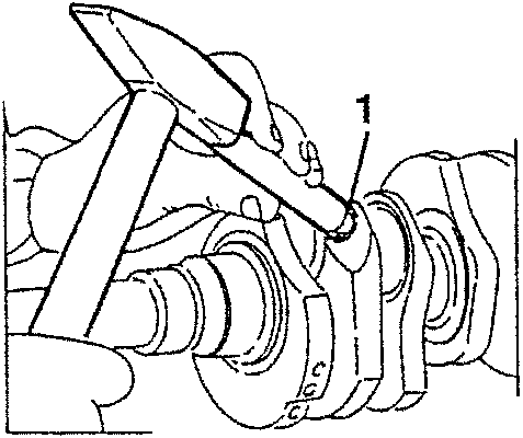 Illustration showing a plug being inserted into a lubrication duct.