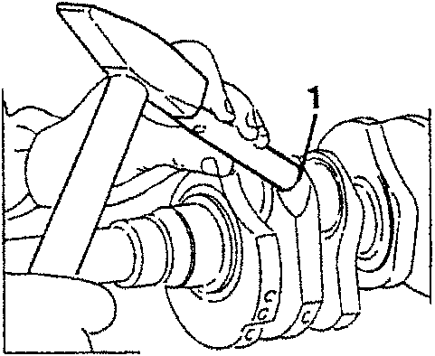 Illustration showing a plug being calked with a tool.