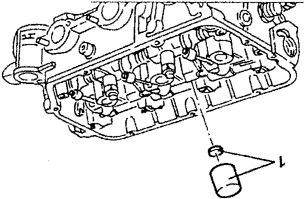 Illustrates valve cover removal with oil filter location indicated