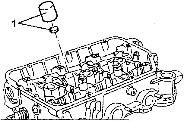 Engine block with cups and tappet clearance adjustment caps shown