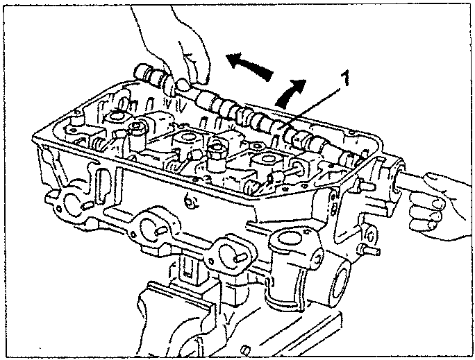 Camshaft being removed from engine block