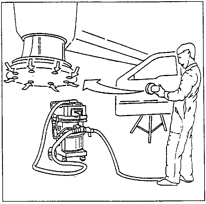 Dry sanding a door panel with an electric sander connected to a dust extraction unit