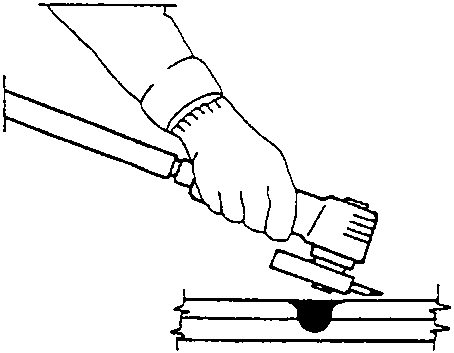 Sanding a weld with a disk sander