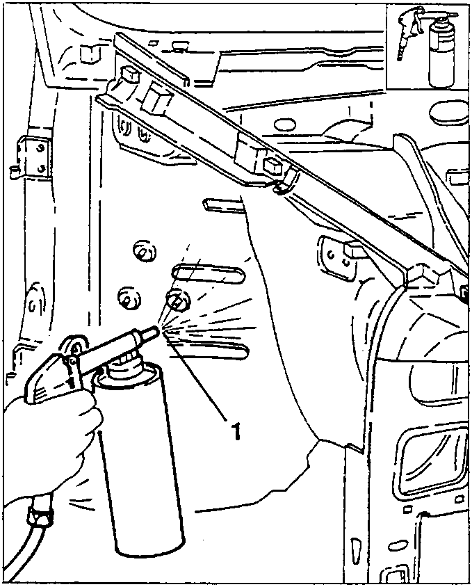 Underbody protection being sprayed onto a car's undercarriage
