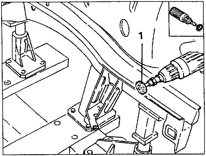 Person using a drill with a brush attachment to clean a weld area, labeled 1