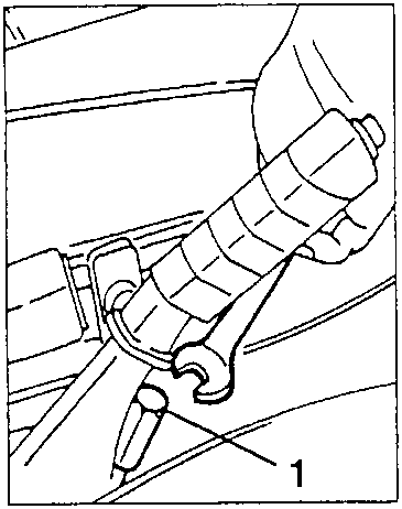 Handbrake lever adjustment nut being unscrewed