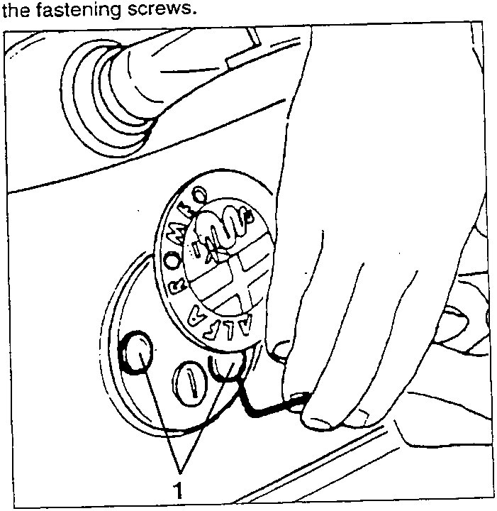 Diagram showing hand turning badge to access screws