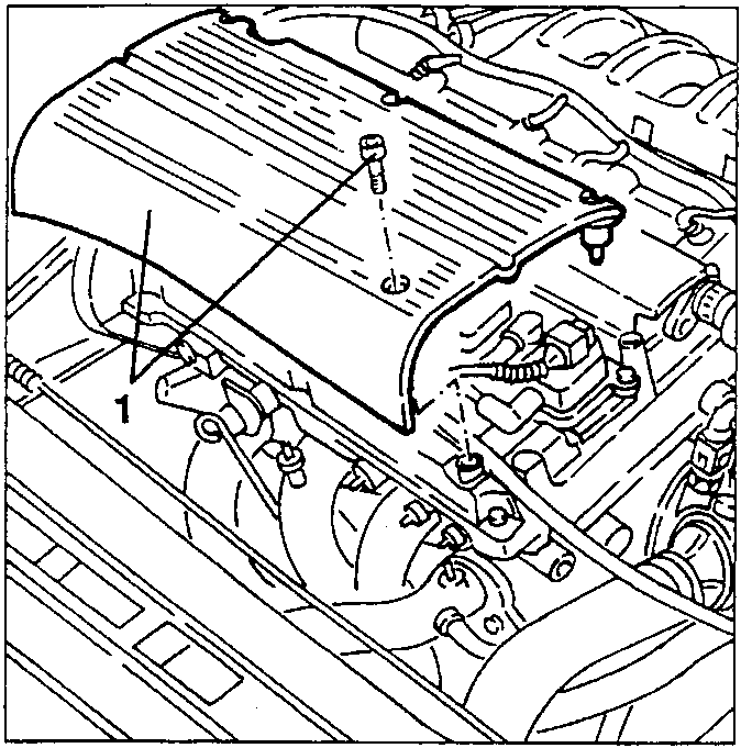 Engine with ignition coils cover being removed.