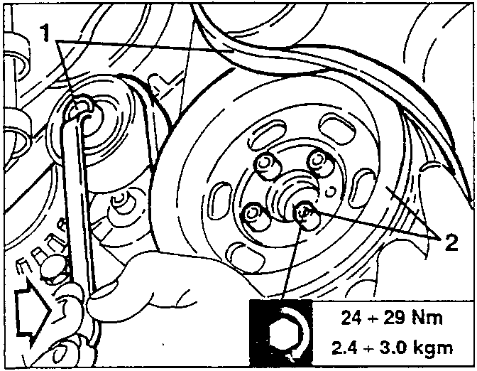 Belt tensioner being loosened with a wrench; torque specification shown: 24 ÷ 29 Nm, 2.4 ÷ 3.0 kgm.
