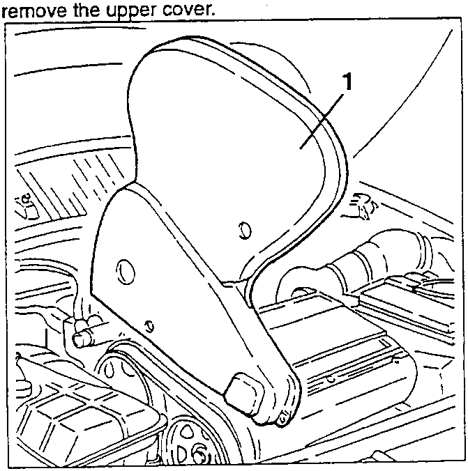 Illustrates removal of upper engine cover component