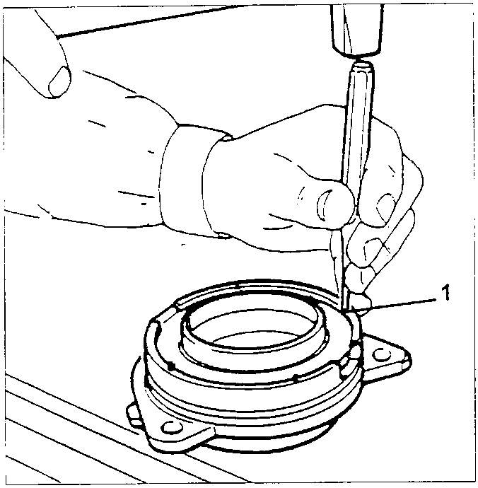 Hand using punch and hammer to install new oil seal