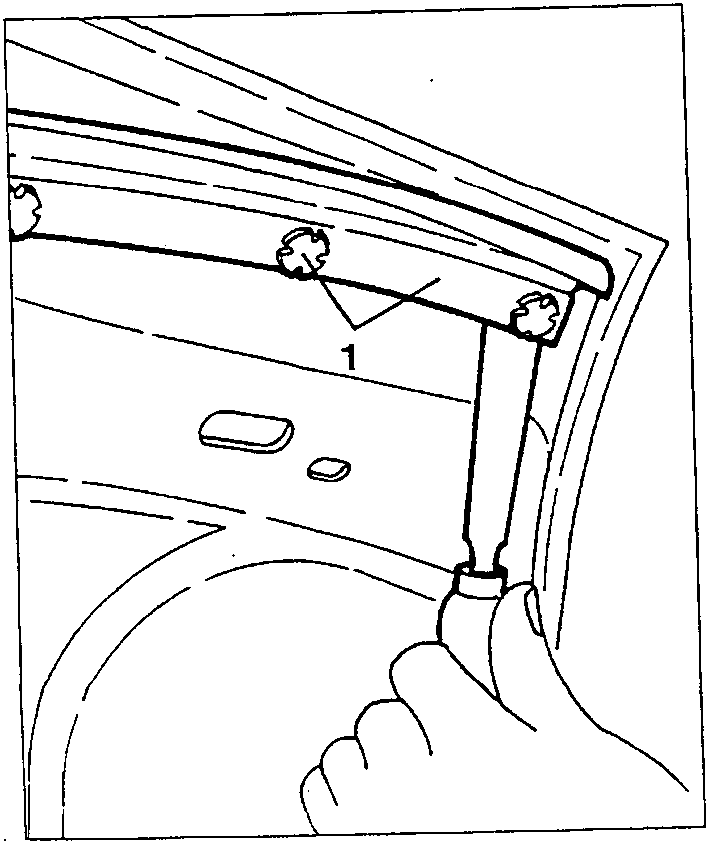Hand using tool to remove plastic button from door trim