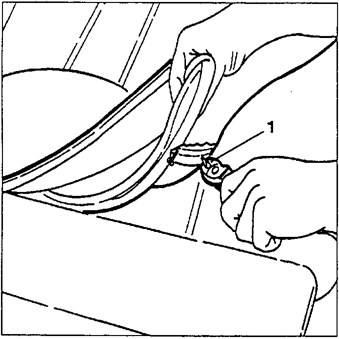 Hand using shears to cut clip securing cover to seat