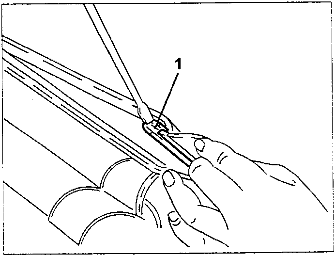 Illustration showing hands using a tool to remove a pin (labeled 1) from a metal frame.