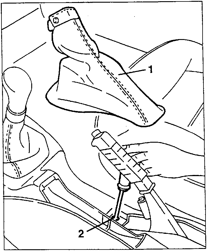 Screwdriver loosening a screw under the handbrake lever