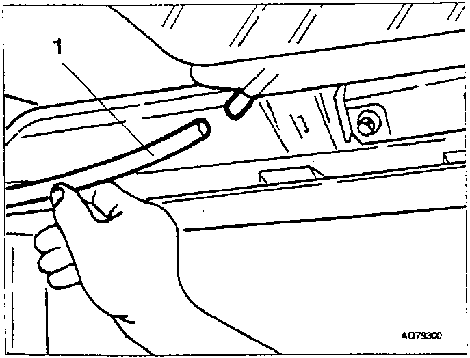 Hand loosening a screw on a sunroof bracket