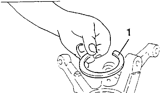 Diagram showing hand assembling a bearing retainer clip 1 into the wheel upright housing.