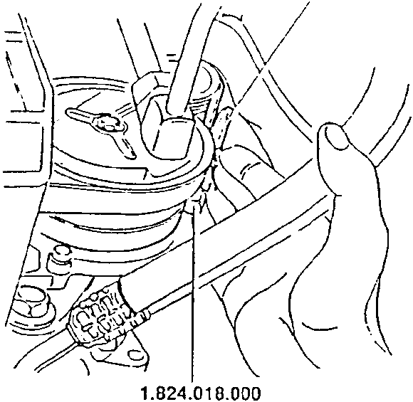 Hand using tool to adjust belt tensioner