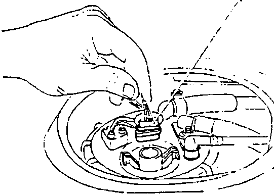 Hand disconnecting electrical connector from fuel level gauge sender