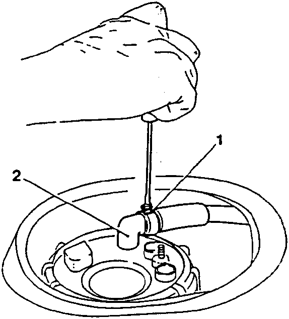 Hand loosening a metal clamp on a breather pipe
