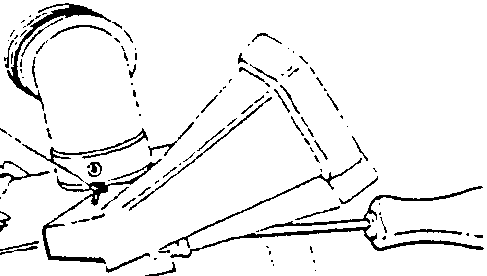 Diagram showing loosening two screws to remove right-hand side outlet