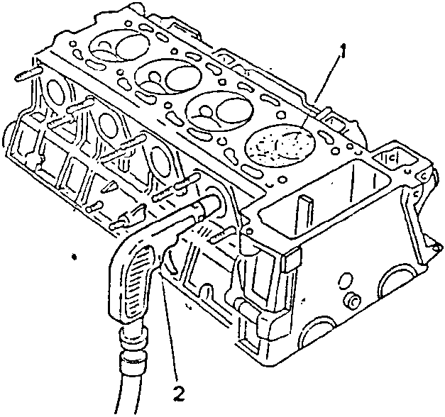 Engine block with spark plugs inserted and air hose connected to intake/exhaust ports