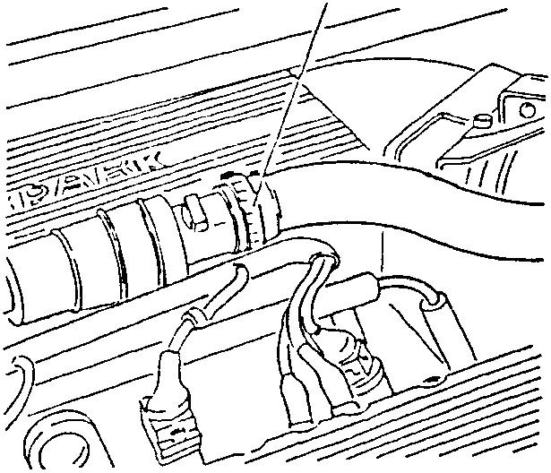 Engine bay showing air intake hose connected to constant idle speed actuator