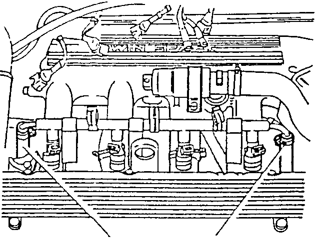 Fuel supply manifold with inlet and outlet hoses disconnected