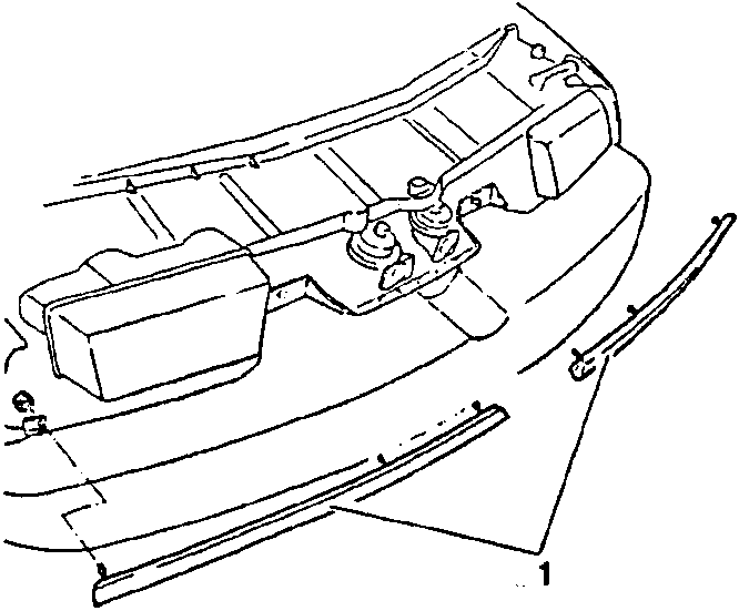 Front view of vehicle front end showing trim strips being removed