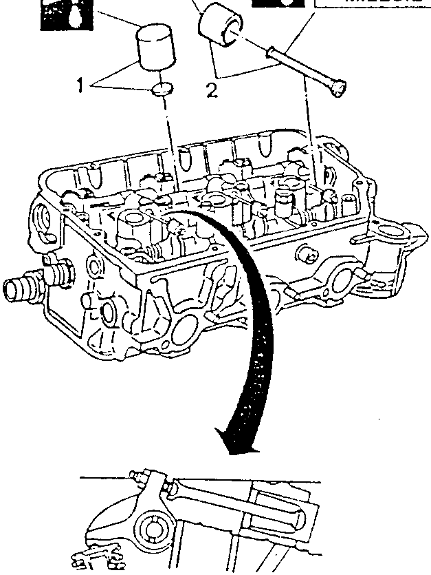 Engine head with rocker arm shaft plug removal indicated