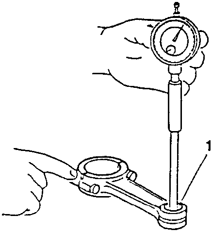 Hand using a dial gauge to measure the diameter of a rod bushing hole on a connecting rod.