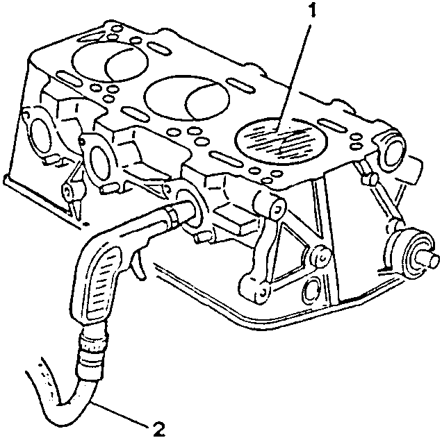 Engine block with spark plug inserted and air hose connected