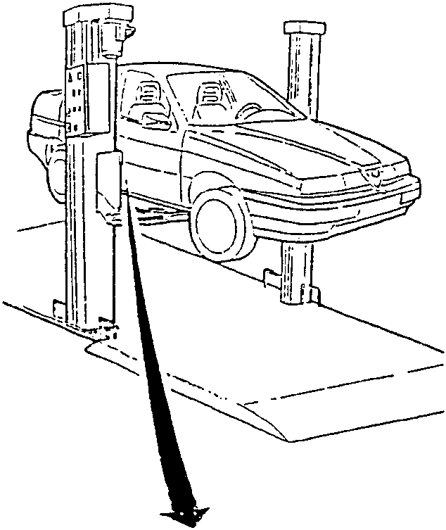 Vehicle raised on a lift with a black arrow pointing down towards the undercarriage