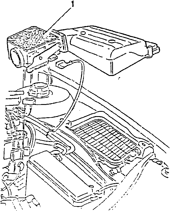 Air flow meter removed from engine, showing mounting points and electrical connector