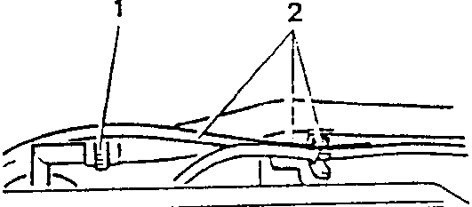 Engine compartment showing spark plug cables and oil vapour recovery hose connection points