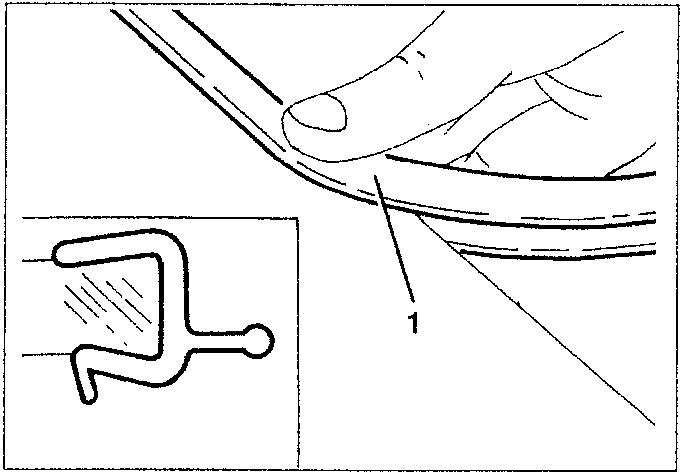 Hand pressing down a new profile onto the windshield edge