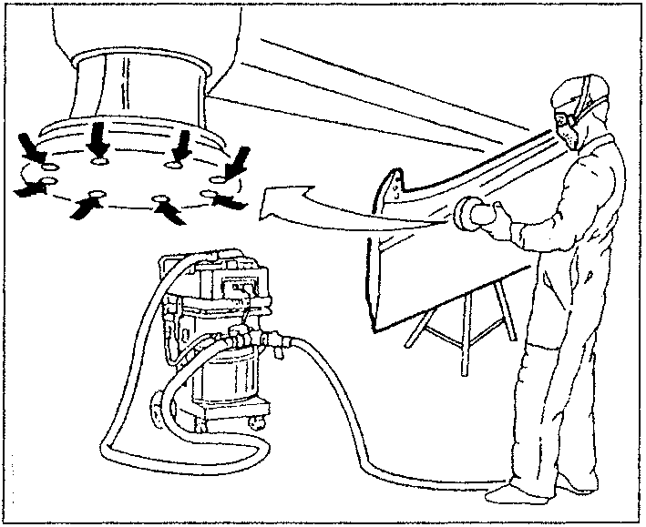 A person wearing protective gear is sanding a metal part with a sander connected to a dust extraction system.