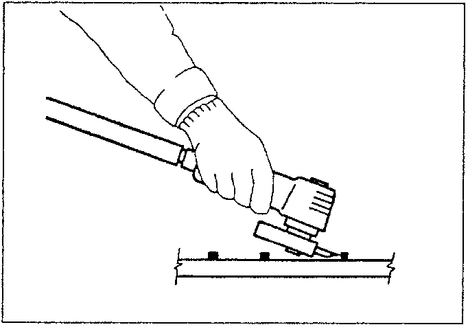 Diagram showing a hand holding a grinding tool over a metal surface with weld spots.