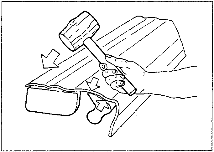 Illustration showing a person using a hammer to straighten a buckled metal panel with a dolly block underneath.