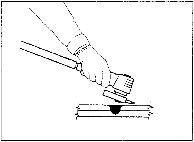 Diagram showing a hand holding a sander tool over a metal surface