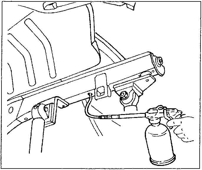 Diagram showing a spray gun applying rust proofing to a vehicle component